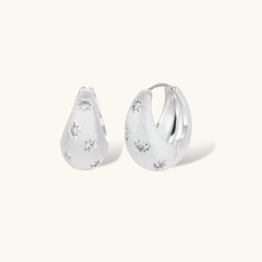 Silver-plated hoop earrings with star cutout designs, shown open and closed on white background, 17mm diameter.